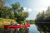 Red Old Town Discovery 158 Canoe Paddled By Two People