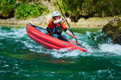 Inflatable white-water kayak with drainage holes