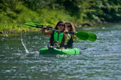 Inflatable kayak for two persons and a small dog.