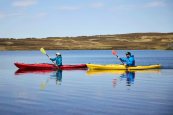 hydra touring on a lake with two paddlers exploring uk waterways