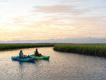 Malibu PDL paddled on calm waters against a sunset