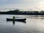 Prospector Sport being slightly keeled over and paddled on flat water